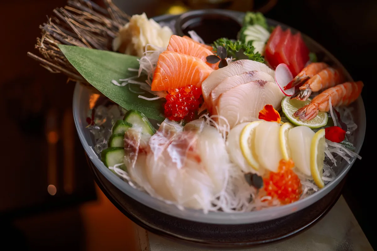 A sashimi platter of sliced raw fish, representative of the sashimi course served on board